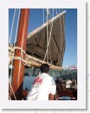 11130015 * Sunset cruising in Koh Samui on the traditional chinese Junk or Sampan.  Raising the main sail. * 1680 x 2240 * (646KB)